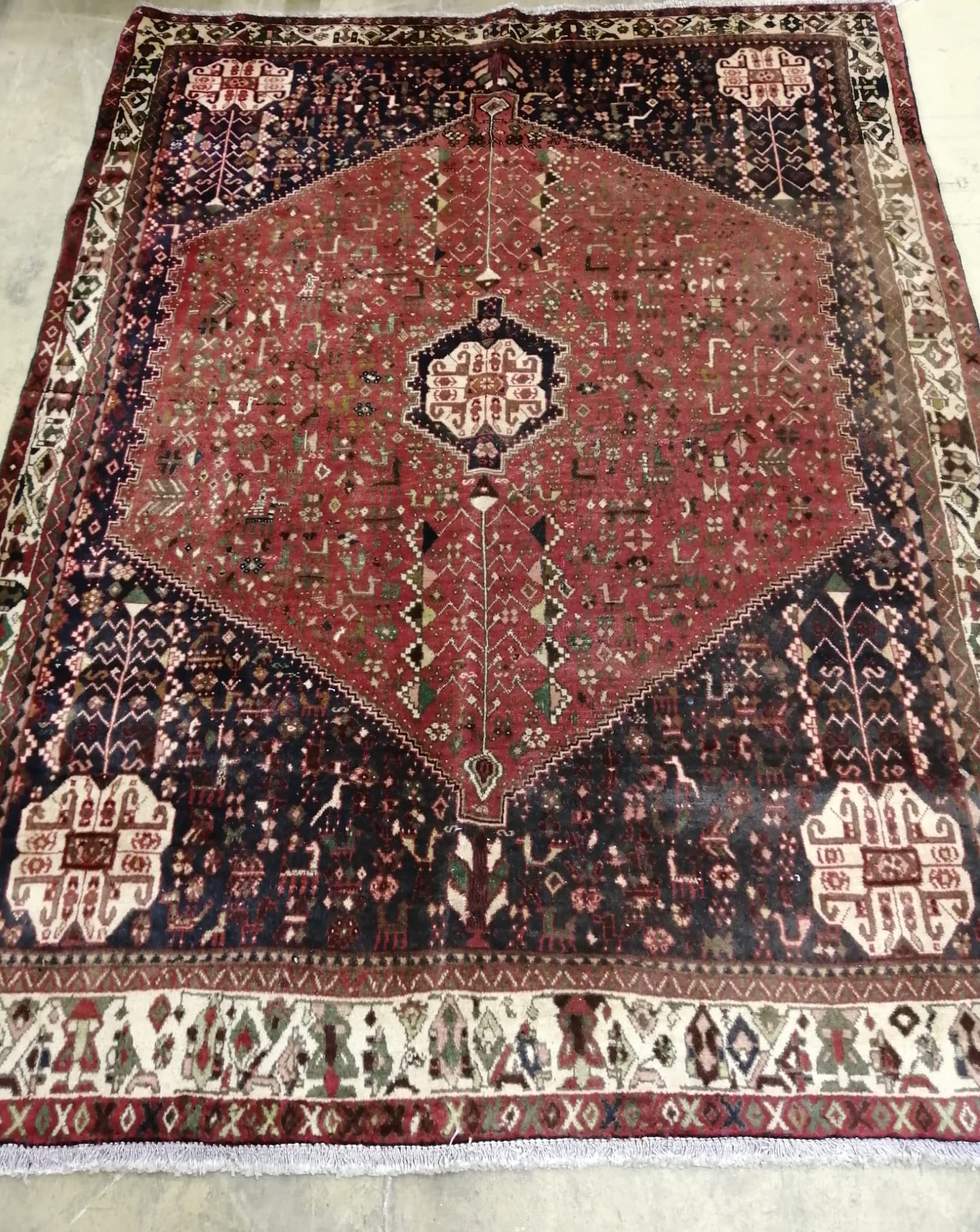 An Abadeh brick red ground carpet, 210 x 155